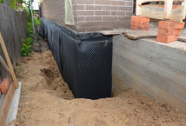 SJ Waterproofing Pros technician performing targeted Foundation Crack Repair assessment in Sylacauga, AL